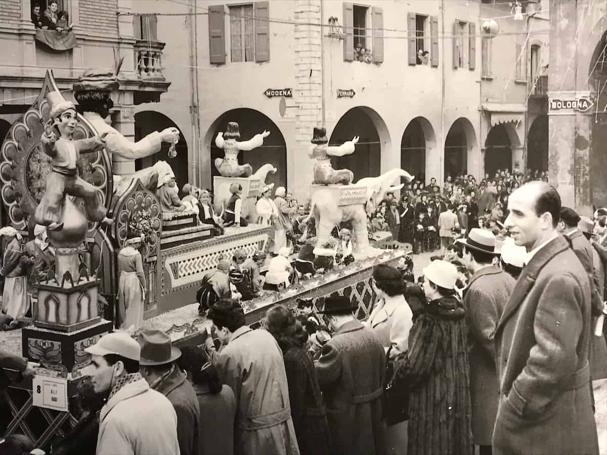 An archival photo of the Cento Carnival hangs in one of the town buildings