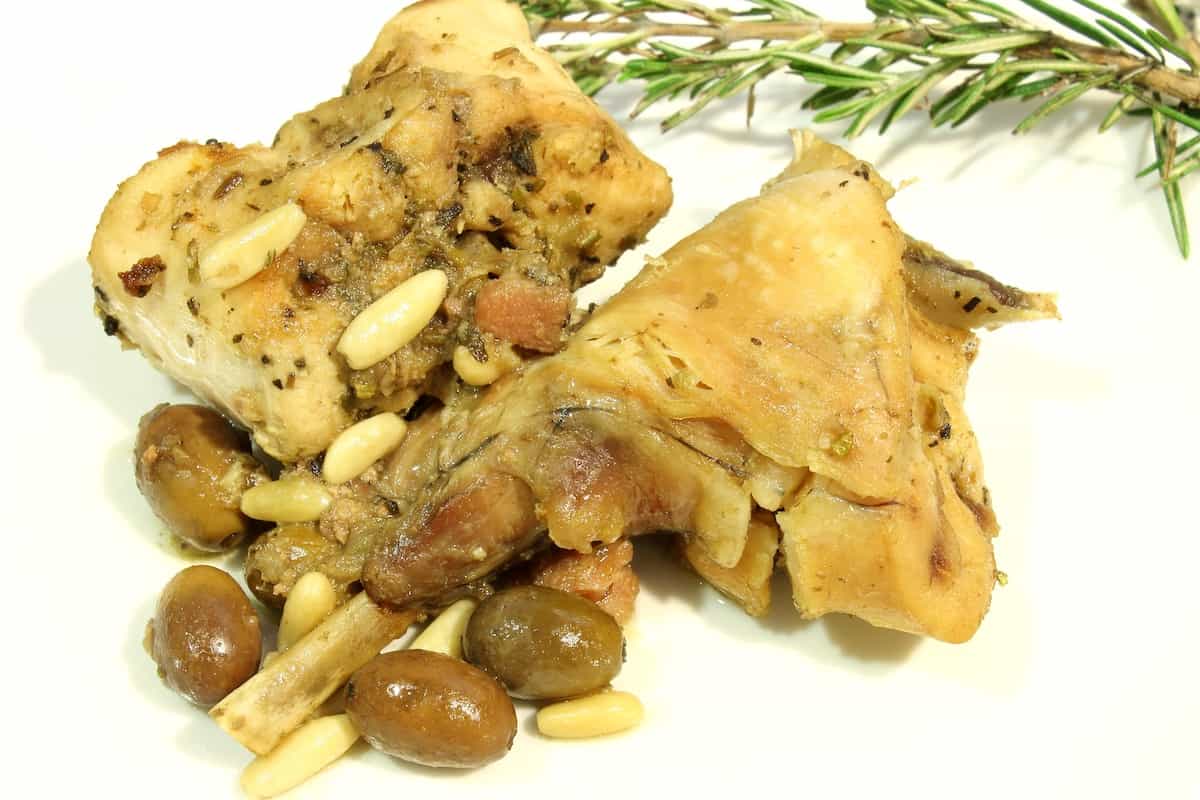 Coniglio alla Ligure with olives and pine nuts