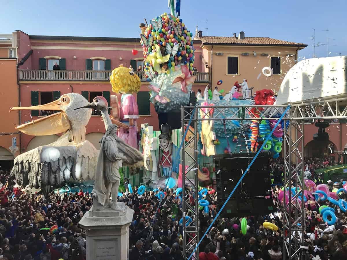 The tall floats at the Cento Carnival tower over the buildings