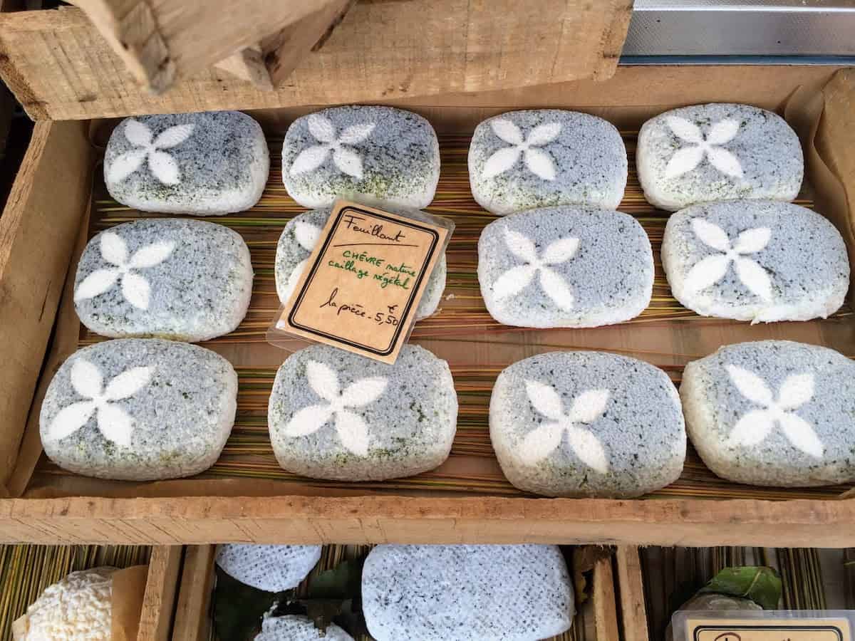 On solo river cruises to France: French cheeses at a market in Bordeaux, France