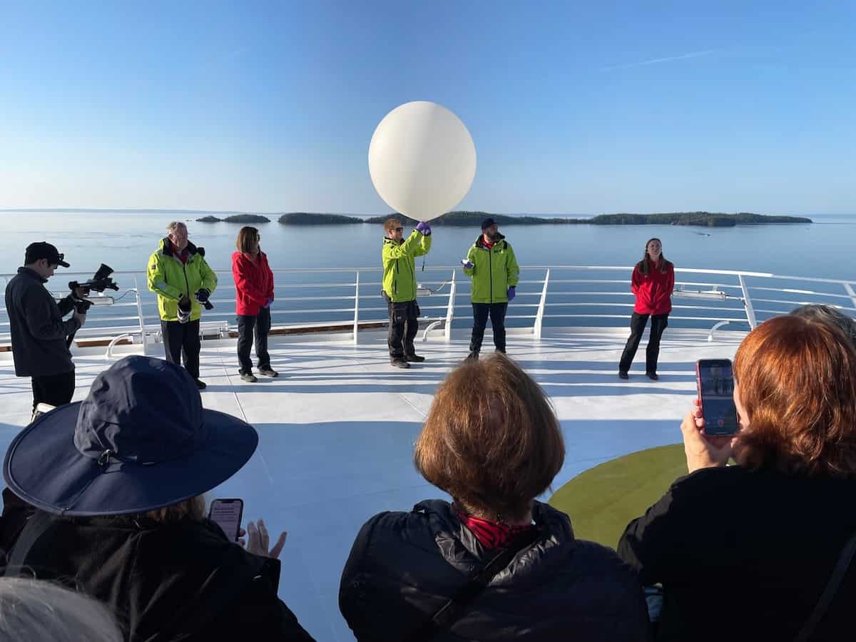 Launching a weather balloon to collect data onboard Viking Octantis