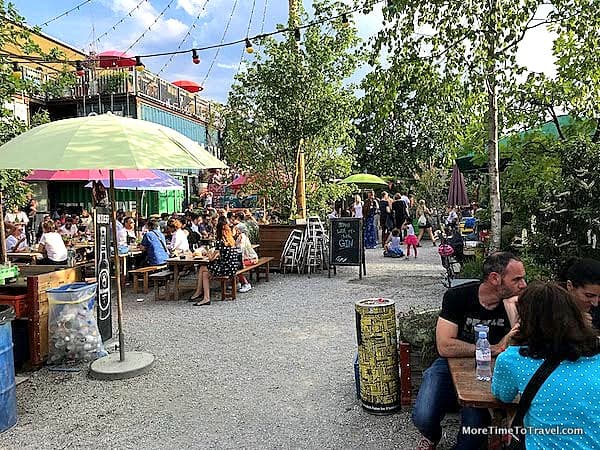 Diners at long wooden tables