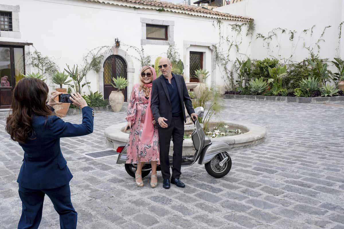 Guests at The White Lotus Hotel in Italy ask Valentina to take their picture (HBO Max/Warner Brothers)