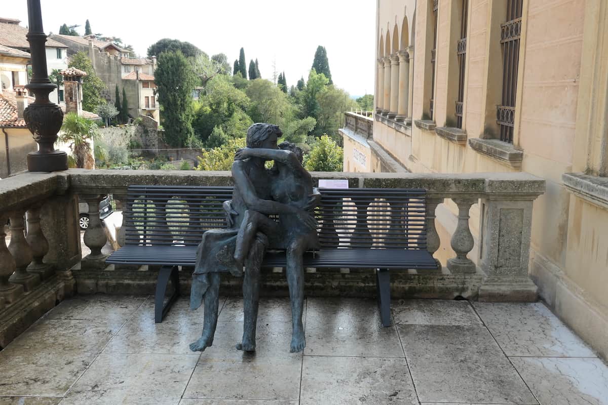 Lovers embrace on a loggia of the Civic Museum of AsoloT