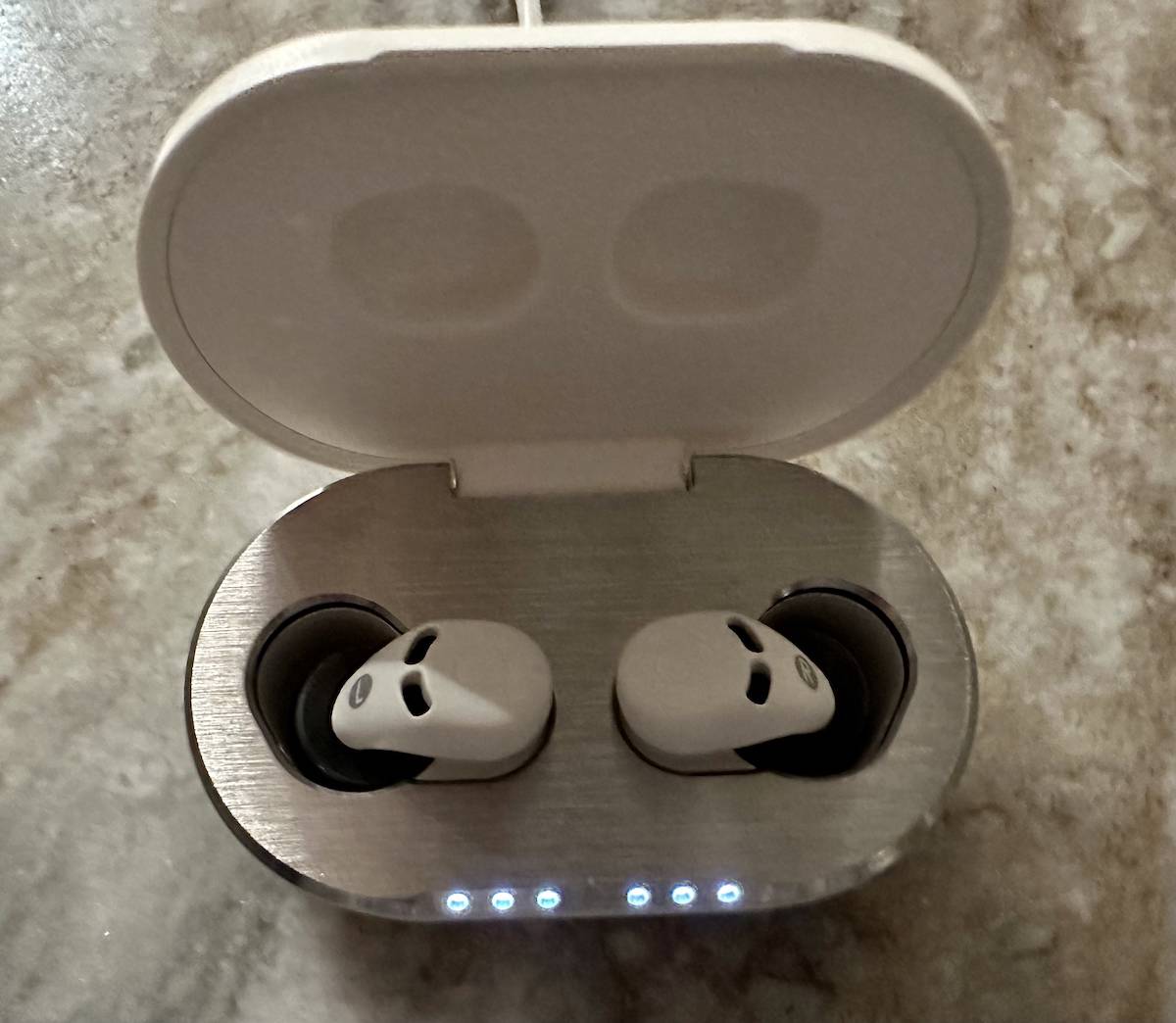 The earbuds in their "bed"