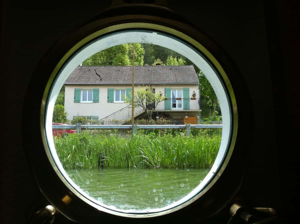 A porthole view on a Burgundy barge trip