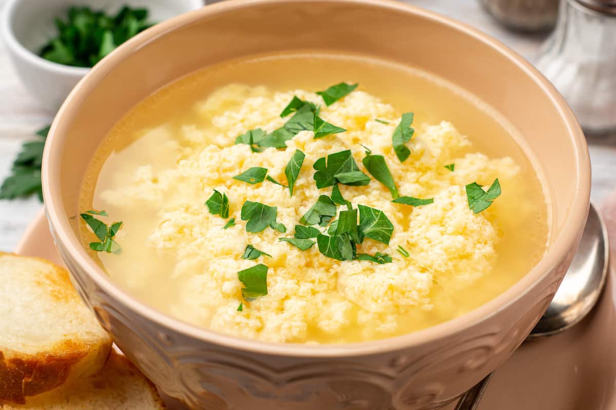 Stracciatella soup with parsley and parmesan cheese