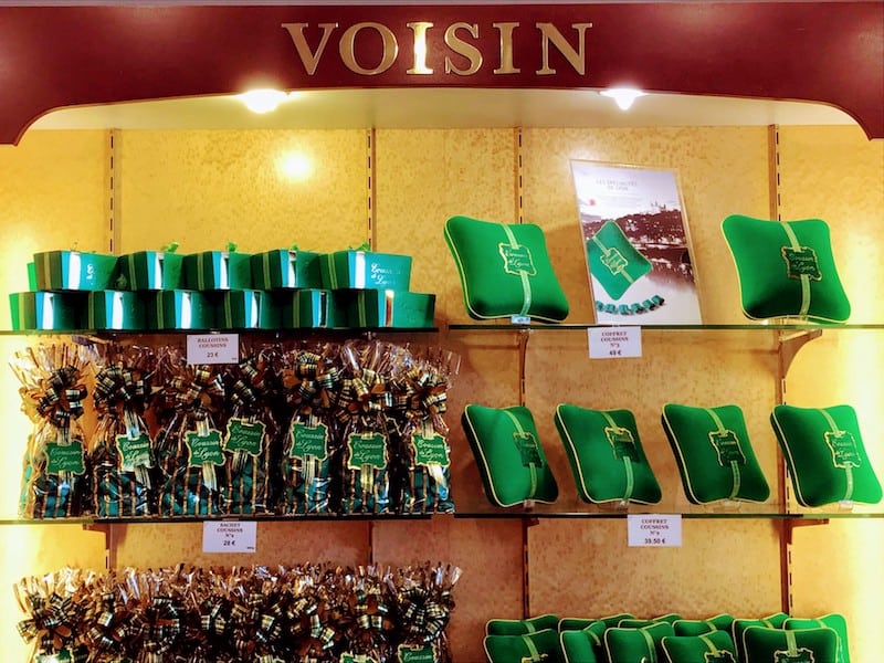 Voisin display of green cushion candies