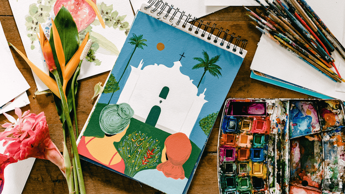 Sketches from artist Fernanda Santiago's notebooks, a representation of locals with a flower offering and the iconic 16th Century church of São João Batista that crowns the Quadrado