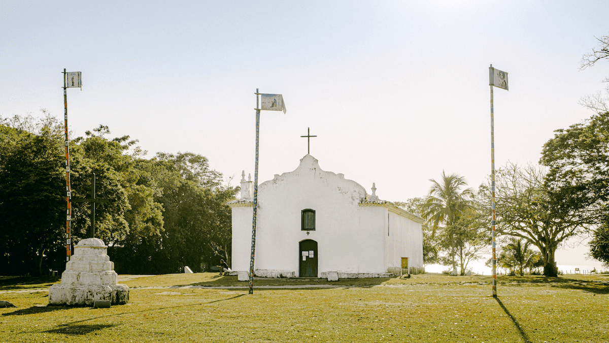 Caption: 16th Century Church of São João Batista, crowning Trancoso's grassy Quadrado